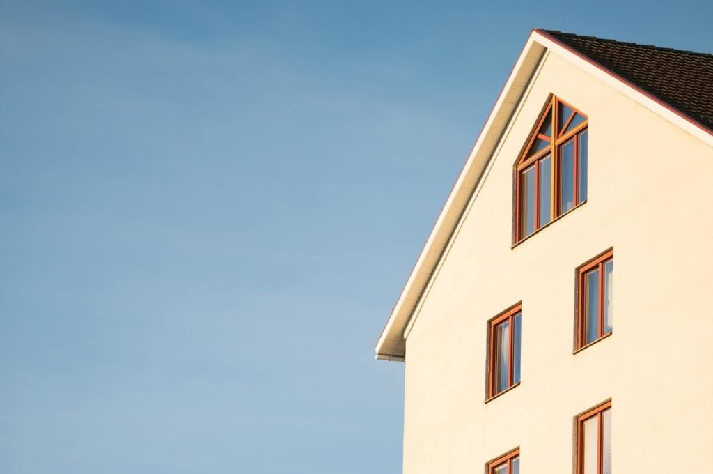 A white house against a blue background
